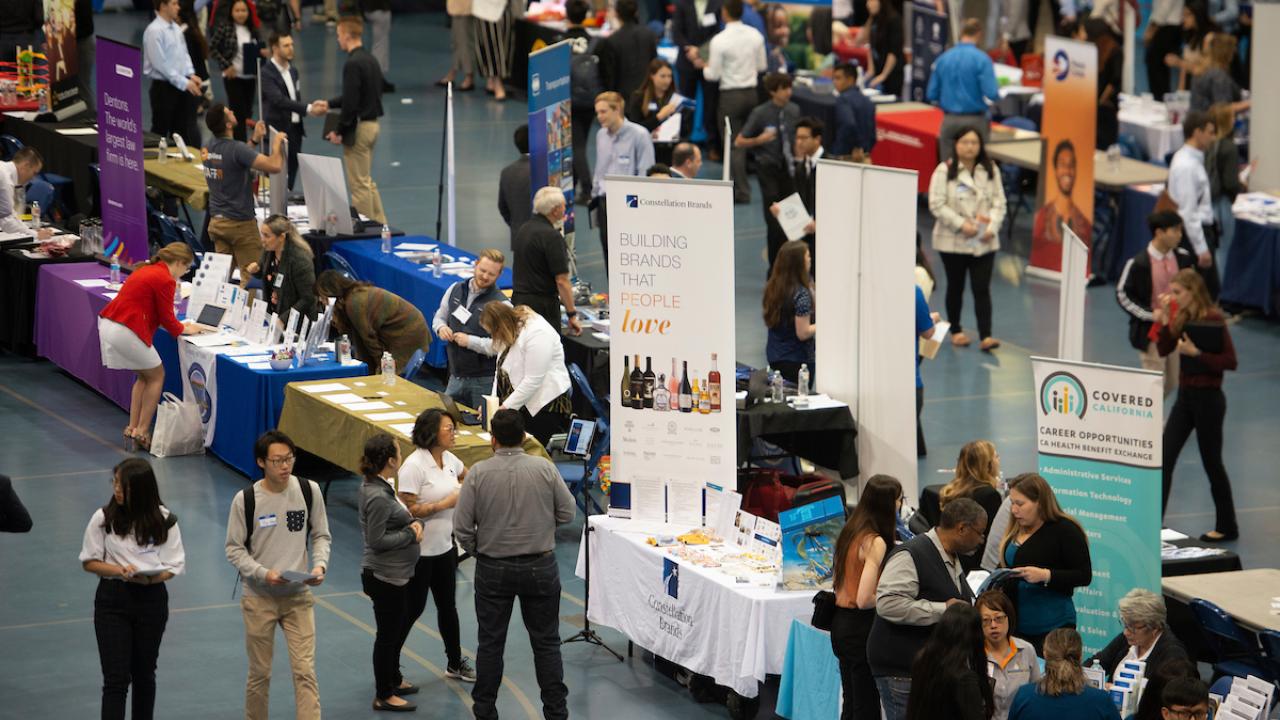 students and recruiters in the gym for career fair