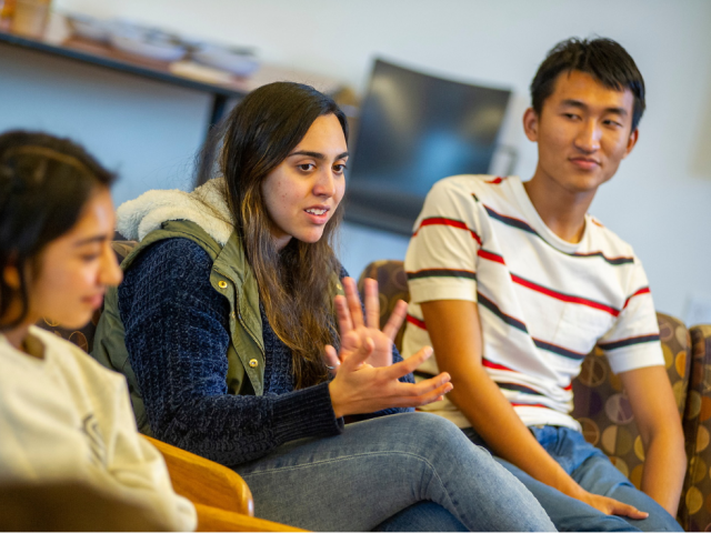 two students listening to someone