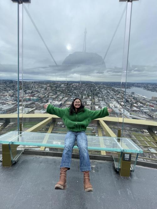 Girl smiling with a city background