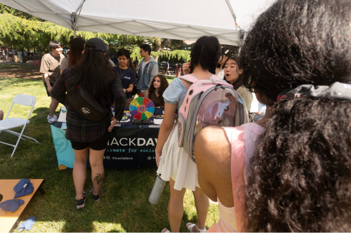 Student line up at a club's booth at an event