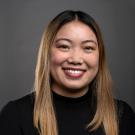 young asian woman with light brown hair and a black sweater