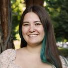 A professional headshot photo of Kelly.